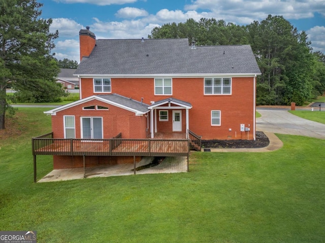 2505 Westchester Way, Conyers, GA 30013 - back of house featuring a chimney, a wooden deck, a yard, and brick siding