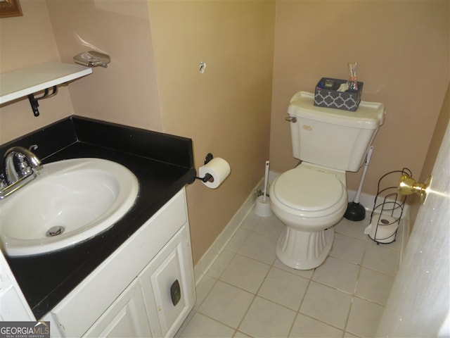 bathroom with tile patterned floors, vanity, and toilet