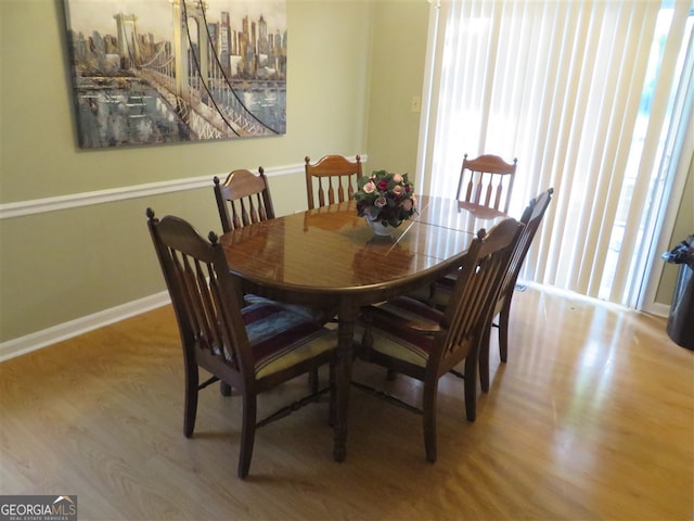 dining area with light hardwood / wood-style floors