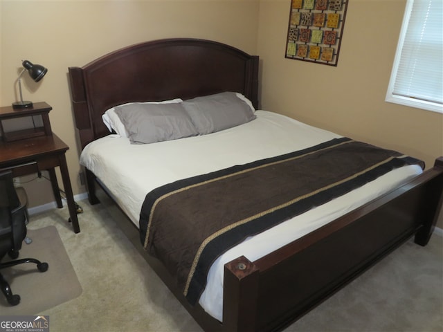 bedroom featuring light colored carpet