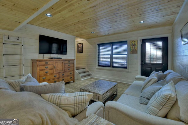 living room with wood-type flooring, wooden ceiling, and wood walls