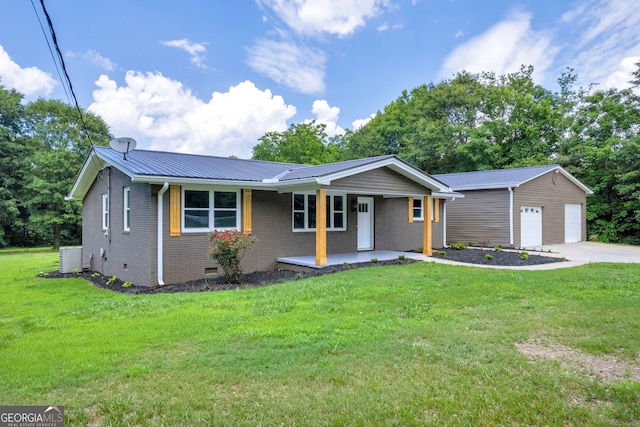 ranch-style house with central AC, a front yard, a garage, covered porch, and an outbuilding