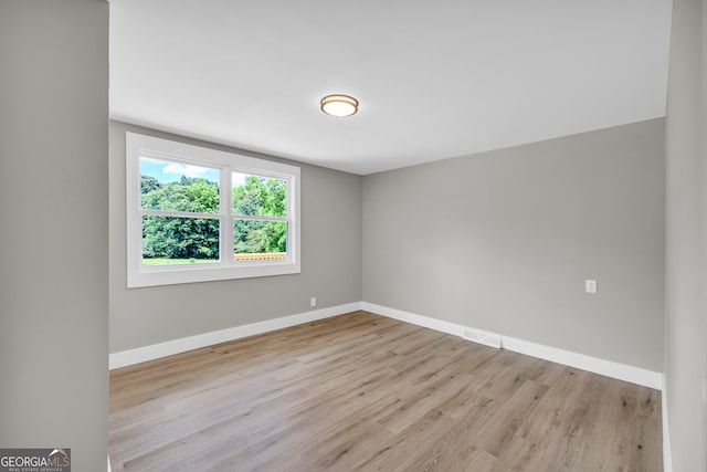 empty room with light wood-type flooring