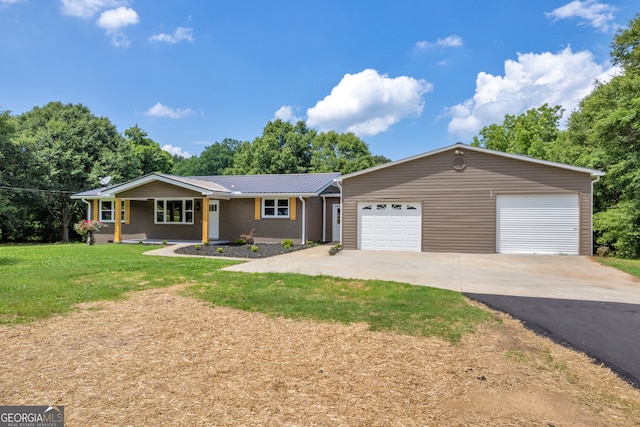 single story home featuring a garage and a front lawn