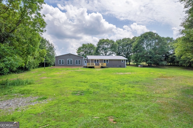 view of yard with a deck