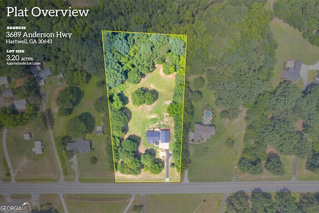 birds eye view of property with a rural view