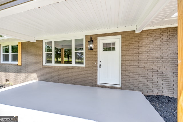 doorway to property with a patio area