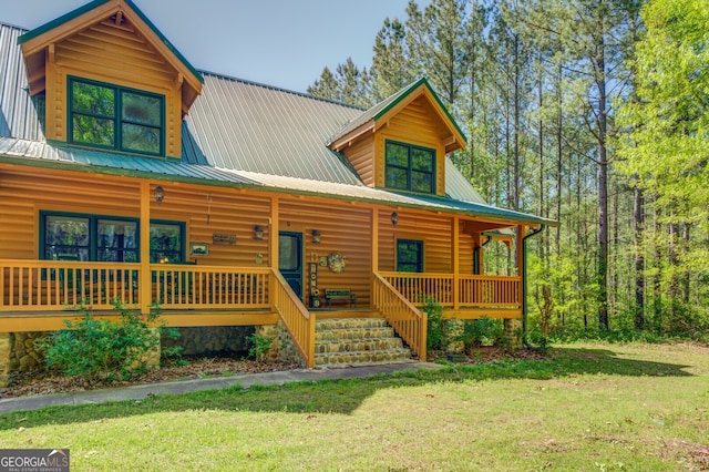 log-style house featuring a front lawn and covered porch