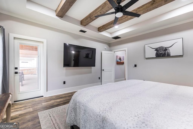 bedroom with beamed ceiling, dark hardwood / wood-style flooring, and ceiling fan