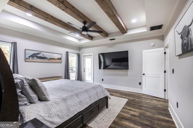 bedroom featuring beam ceiling, multiple windows, ceiling fan, and dark wood-type flooring