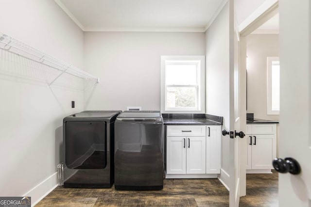 laundry area with washer and dryer, cabinets, ornamental molding, and dark wood-type flooring