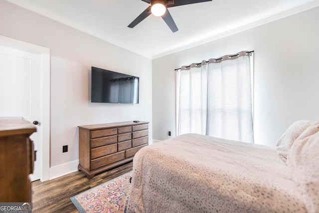 bedroom featuring ceiling fan and dark hardwood / wood-style floors