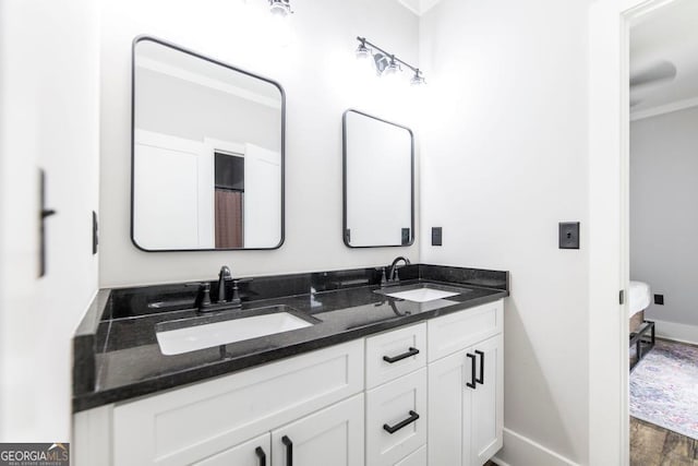 bathroom with vanity and hardwood / wood-style flooring