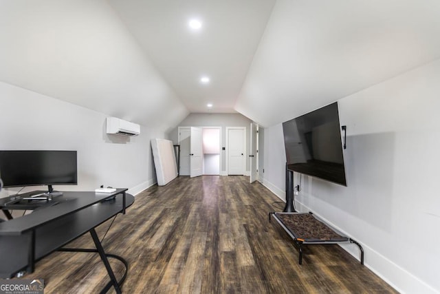 home office featuring a wall unit AC, dark hardwood / wood-style flooring, and vaulted ceiling