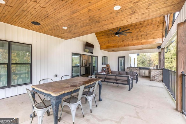 view of patio with outdoor lounge area, an outdoor kitchen, and ceiling fan