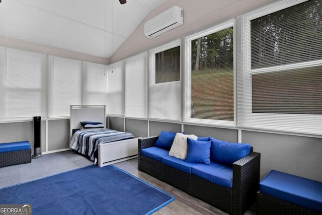 sunroom featuring a wall mounted AC, lofted ceiling, and ceiling fan