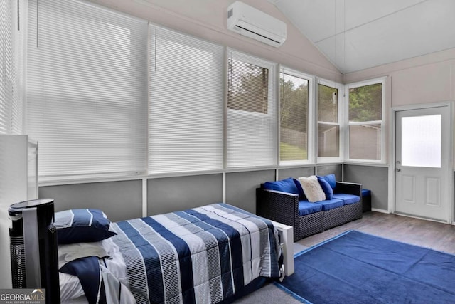 sunroom with a wall unit AC and vaulted ceiling