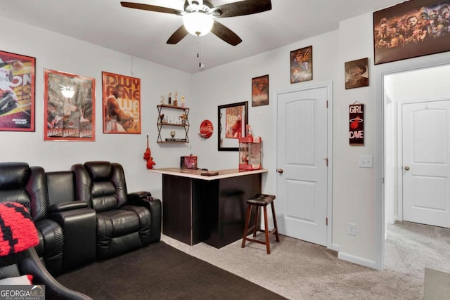 cinema room with carpet and ceiling fan