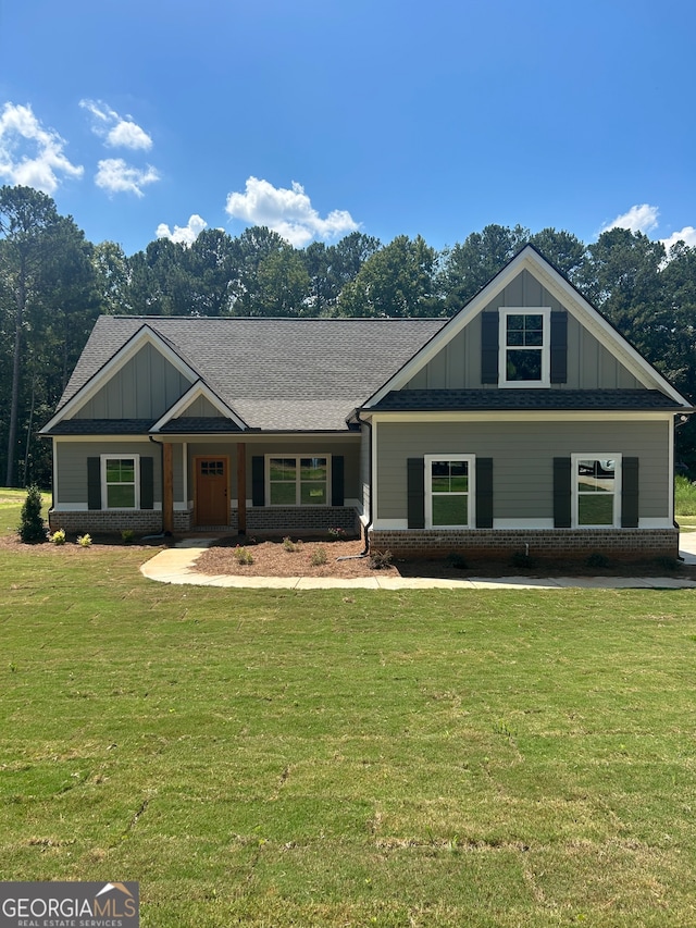 craftsman-style house with a front lawn