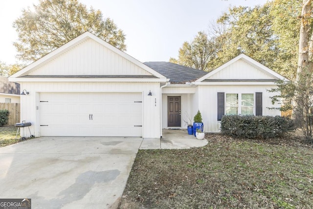 ranch-style home with a garage and a front yard