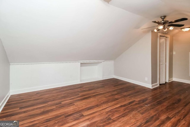 bonus room with lofted ceiling, ceiling fan, and dark hardwood / wood-style floors