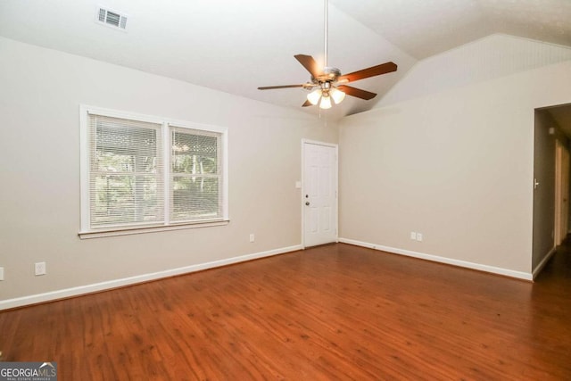 spare room with ceiling fan, dark hardwood / wood-style flooring, and lofted ceiling