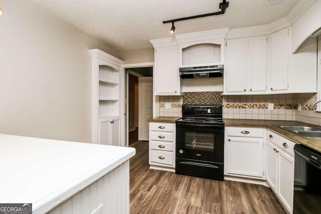 kitchen featuring white cabinetry, sink, dark hardwood / wood-style floors, decorative backsplash, and black appliances