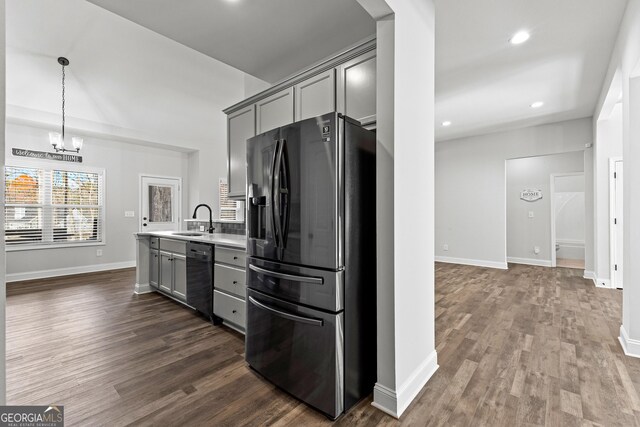 kitchen featuring sink, dishwasher, dark wood-type flooring, stainless steel fridge with ice dispenser, and gray cabinets