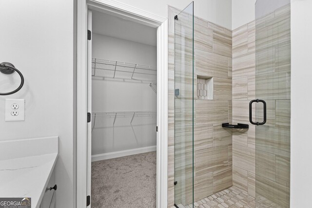 bathroom with vanity and an enclosed shower