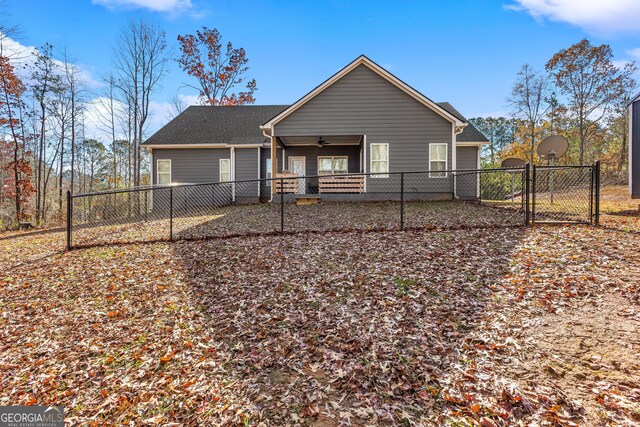 rear view of house with ceiling fan