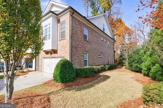 view of side of property with a garage