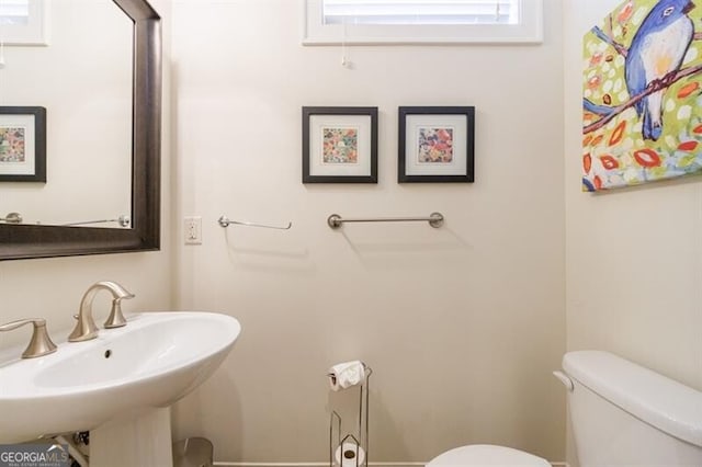 bathroom with toilet and sink