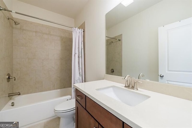 full bathroom featuring shower / bath combo with shower curtain, vanity, and toilet