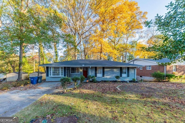 ranch-style home with a shed