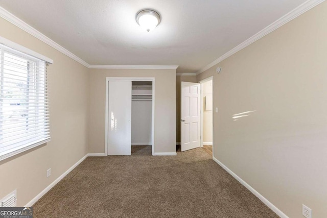 unfurnished bedroom with a closet, carpet, and ornamental molding