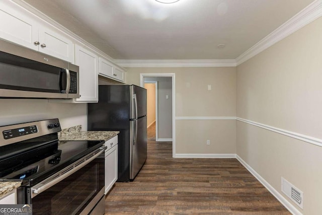 kitchen with light stone countertops, white cabinetry, stainless steel appliances, dark hardwood / wood-style floors, and ornamental molding