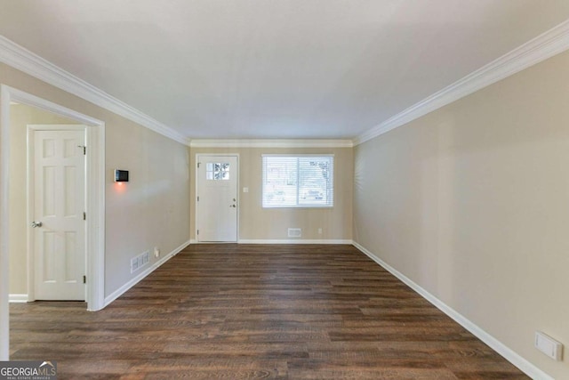 entrance foyer featuring dark wood-type flooring and ornamental molding