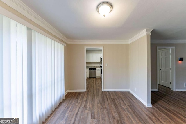 spare room with crown molding and dark wood-type flooring