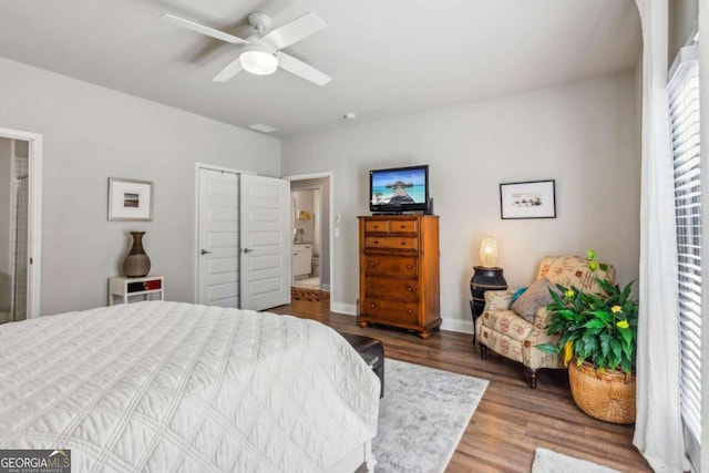 bedroom featuring ceiling fan, a closet, and hardwood / wood-style flooring