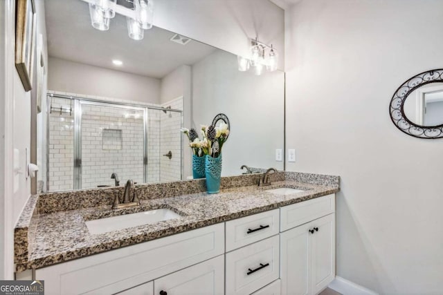 bathroom featuring vanity and walk in shower