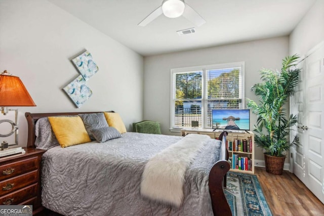 bedroom with wood-type flooring and ceiling fan