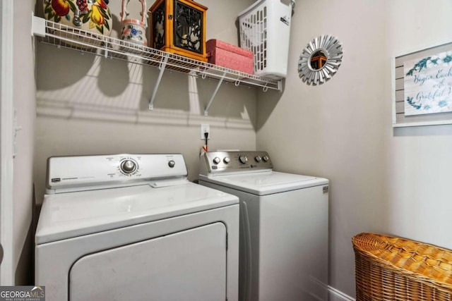 laundry room with independent washer and dryer