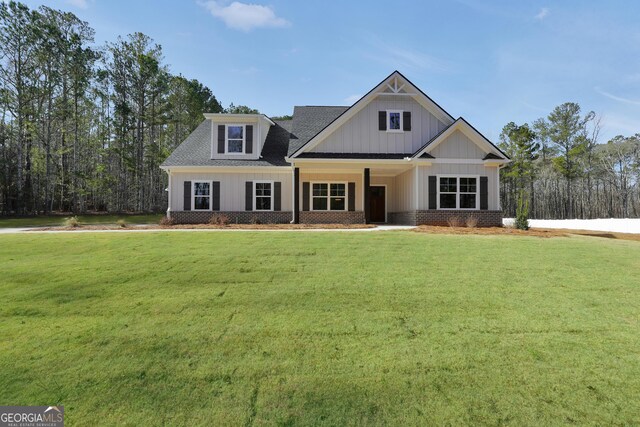 view of front of property with a front yard and a garage