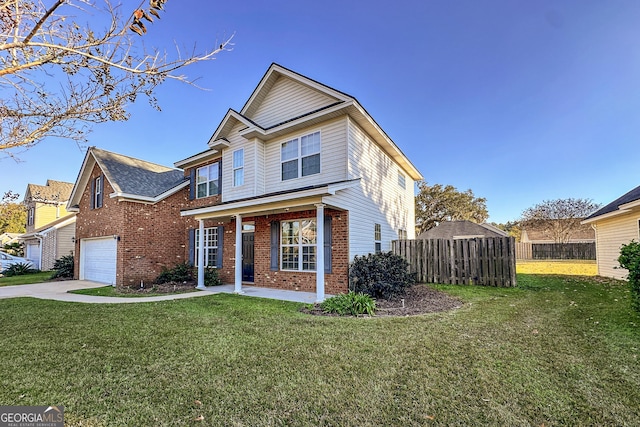 view of front of property featuring a front lawn and a garage