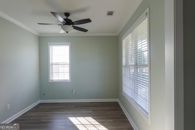 unfurnished room with ceiling fan, a healthy amount of sunlight, ornamental molding, and dark wood-type flooring