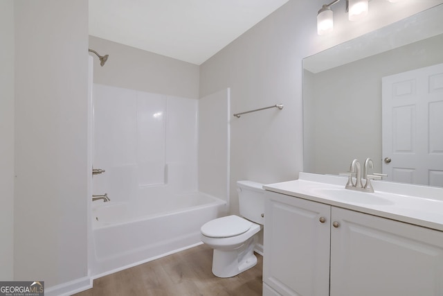 full bathroom featuring vanity, shower / bath combination, hardwood / wood-style flooring, and toilet