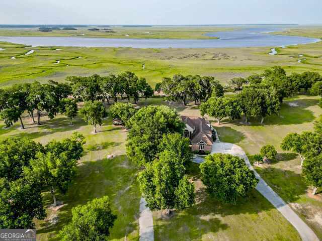 birds eye view of property featuring a rural view and a water view