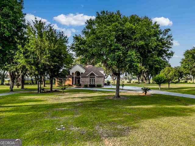 surrounding community with a lawn