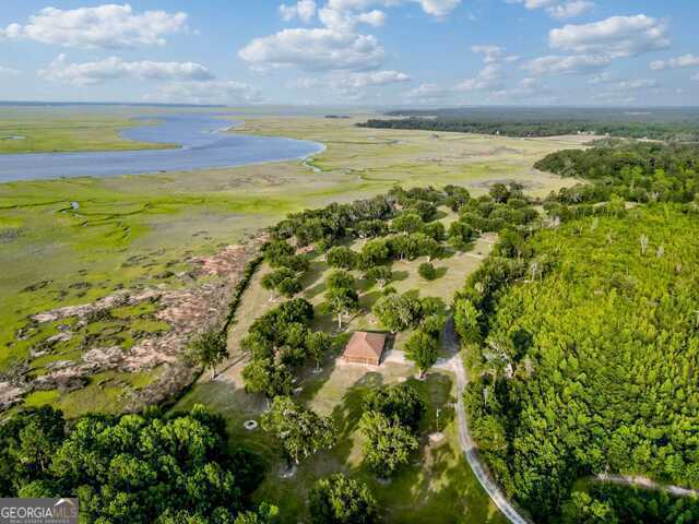 aerial view with a rural view and a water view