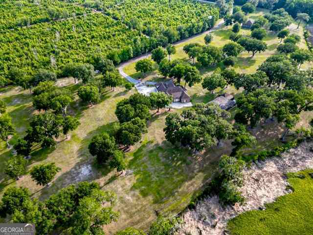 birds eye view of property featuring a rural view